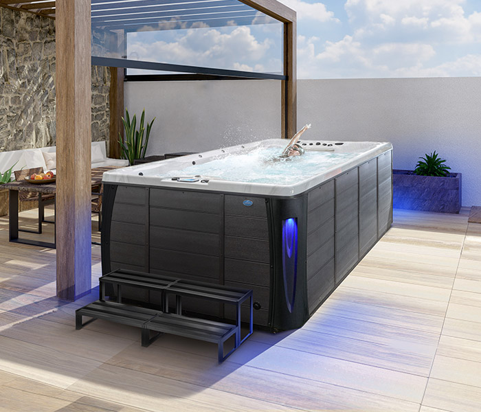 Hot Tubs, Spas, Portable Spas, Swim Spas for Sale Hot Tubs, Spas, Portable Spas, Swim Spas for Sale Calspas hot tub being used in a family setting